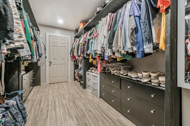 1607 N Mary-Ellen St, Pampa, TX 79065 - walk in closet with light wood-style flooring