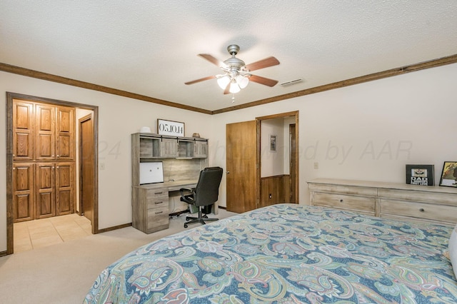 314 Fir St, Hereford, TX 79045 - bedroom featuring an office area, light carpet, ornamental molding, ceiling fan, and a textured ceiling