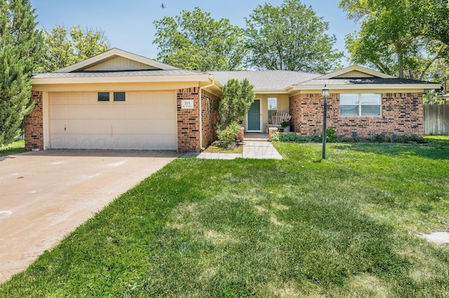 314 Fir St, Hereford, TX 79045 - ranch-style house with brick siding, a garage, and driveway