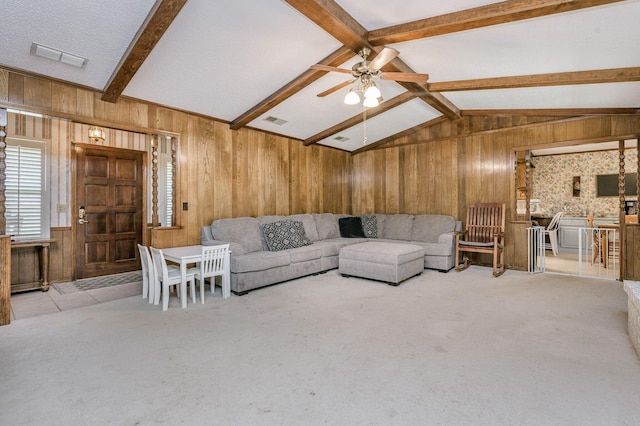 314 Fir St, Hereford, TX 79045 - living room with wood walls, a ceiling fan, and carpet