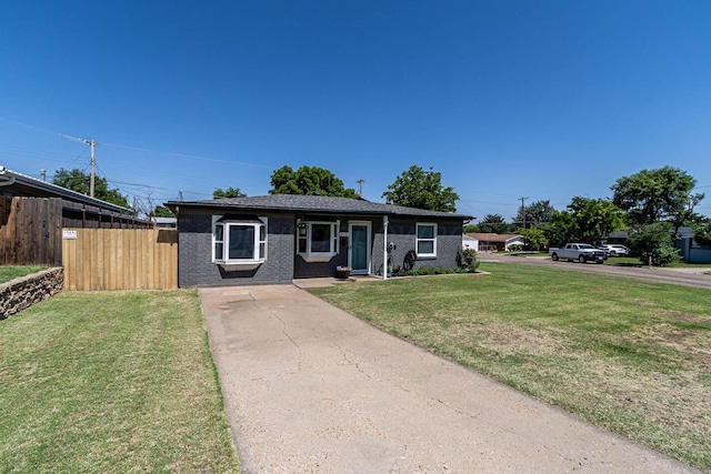 215 Abilene St, Borger, TX 79007 - view of front facade featuring brick siding and concrete driveway