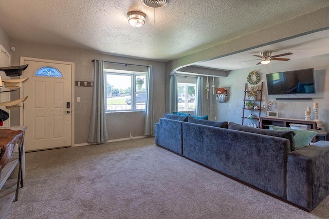 215 Abilene St, Borger, TX 79007 - carpeted living area with ceiling fan and a textured ceiling
