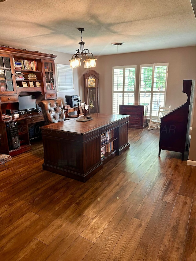 112 Houston St, Borger, TX 79007 - office with dark wood-style floors and a textured ceiling