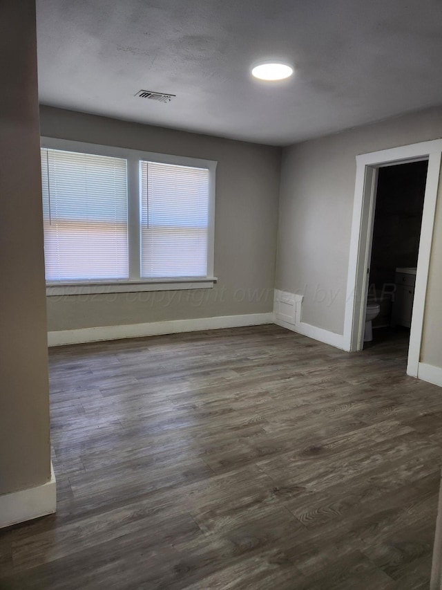 904 S Mississippi St, Amarillo, TX 79106 - unfurnished room featuring baseboards and dark wood-style floors
