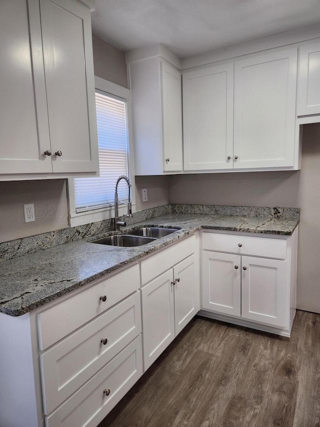 904 S Mississippi St, Amarillo, TX 79106 - kitchen featuring a sink, dark wood-style flooring, white cabinets, and light stone countertops