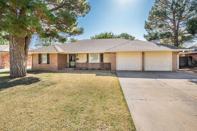 single story home with a garage and a front yard