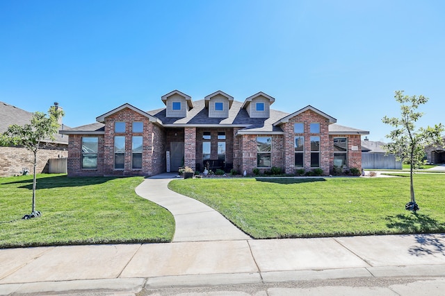 9709 Sydney Dr, Amarillo, TX 79119 - view of front of property with brick siding, a front lawn, and a shingled roof