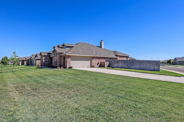 9709 Sydney Dr, Amarillo, TX 79119 - view of side of home with driveway, brick siding, an attached garage, and a chimney