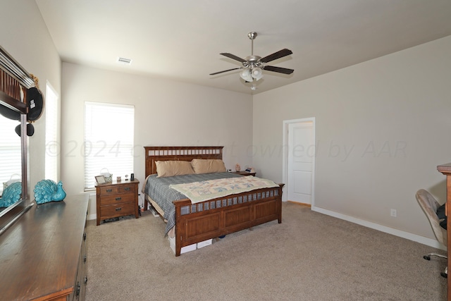 9709 Sydney Dr, Amarillo, TX 79119 - bedroom with multiple windows, light colored carpet, and ceiling fan