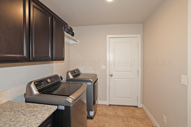 9709 Sydney Dr, Amarillo, TX 79119 - washroom with cabinet space, independent washer and dryer, baseboards, and light tile patterned flooring