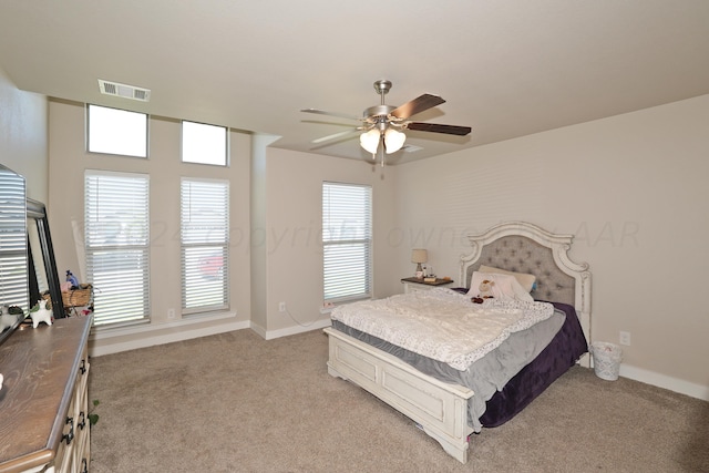 9709 Sydney Dr, Amarillo, TX 79119 - bedroom with light carpet, baseboards, and ceiling fan