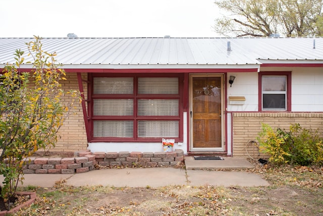 2501 S Bivins St, Amarillo, TX 79103 - doorway to property with brick siding and a metal roof