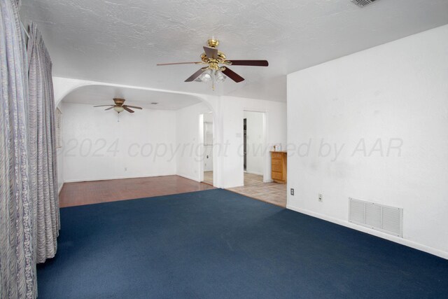 2501 S Bivins St, Amarillo, TX 79103 - spare room featuring a ceiling fan, arched walkways, and carpet floors