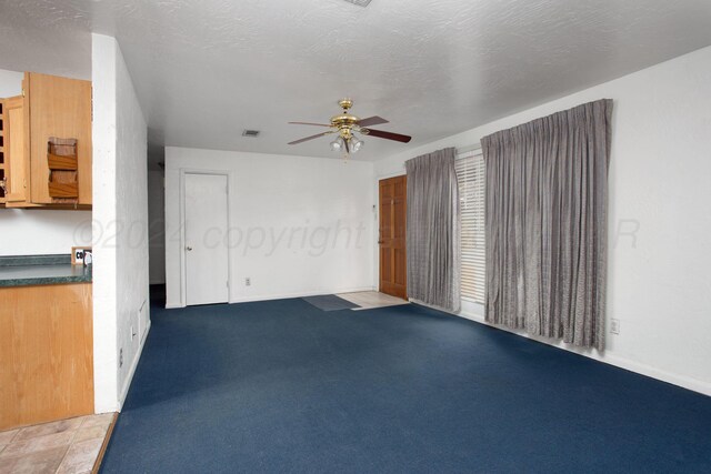 2501 S Bivins St, Amarillo, TX 79103 - unfurnished living room with ceiling fan and baseboards