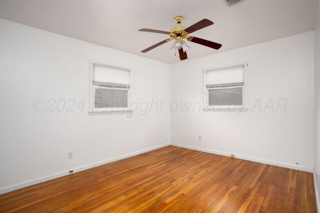 2501 S Bivins St, Amarillo, TX 79103 - empty room with wood finished floors and ceiling fan