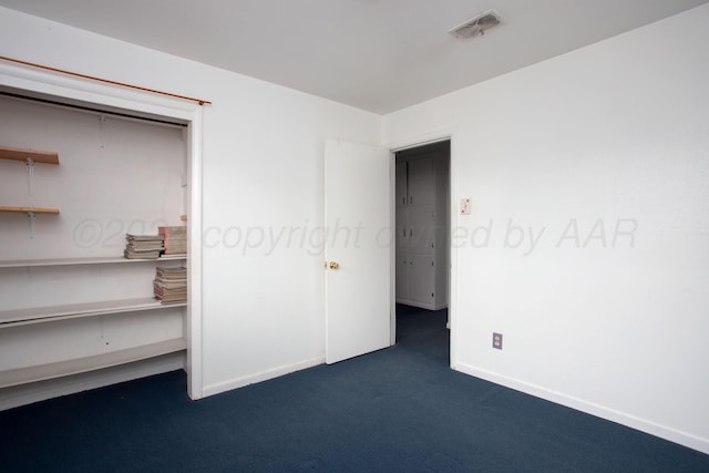 2501 S Bivins St, Amarillo, TX 79103 - unfurnished bedroom with dark colored carpet and baseboards