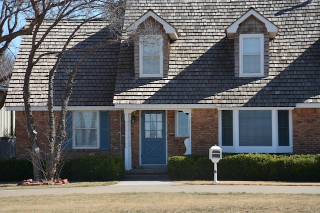 view of front of home with brick siding