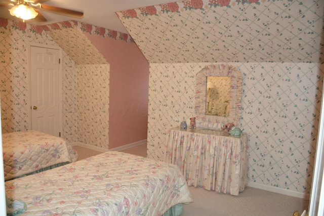 carpeted bedroom with baseboards, a ceiling fan, and wallpapered walls