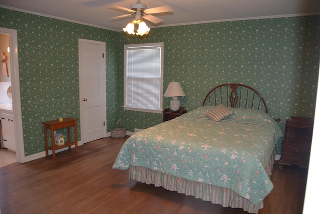 bedroom with ornamental molding, wallpapered walls, baseboards, and wood finished floors