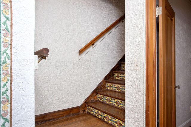 2615 S Hayden St, Amarillo, TX 79109 - stairway featuring wood finished floors and a textured wall