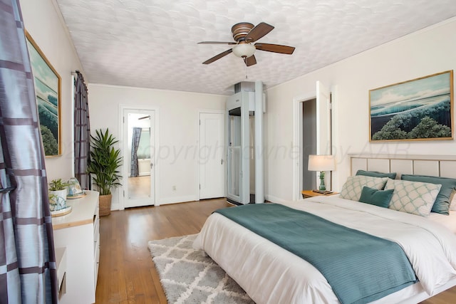 2615 S Hayden St, Amarillo, TX 79109 - bedroom with wood finished floors, ornamental molding, and ceiling fan