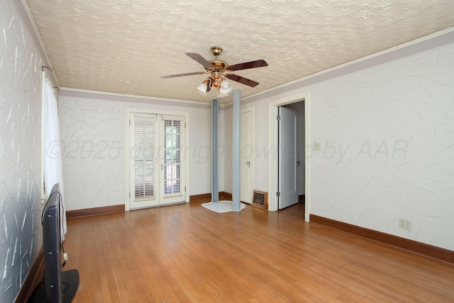 2615 S Hayden St, Amarillo, TX 79109 - unfurnished living room featuring ornamental molding, wood finished floors, and a ceiling fan