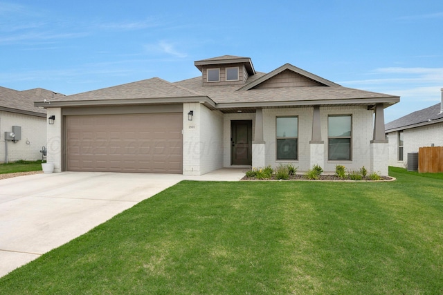 1801 Callaway Pl, Amarillo, TX 79118 - prairie-style home with a garage, driveway, roof with shingles, central air condition unit, and brick siding