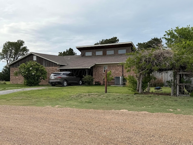 14680 County Road 6, Booker, TX 79005 - mid-century inspired home featuring brick siding, a front lawn, central air condition unit, dirt driveway, and a shingled roof