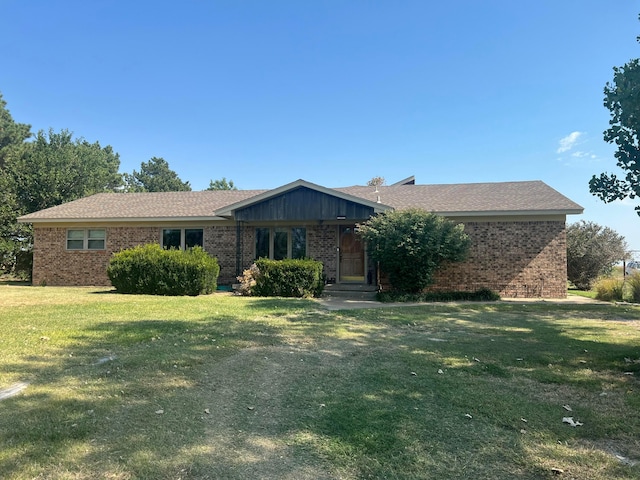 14680 County Road 6, Booker, TX 79005 - single story home with brick siding and a front yard
