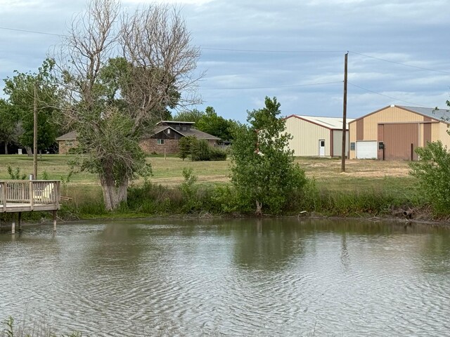 14680 County Road 6, Booker, TX 79005 - water view with an outbuilding