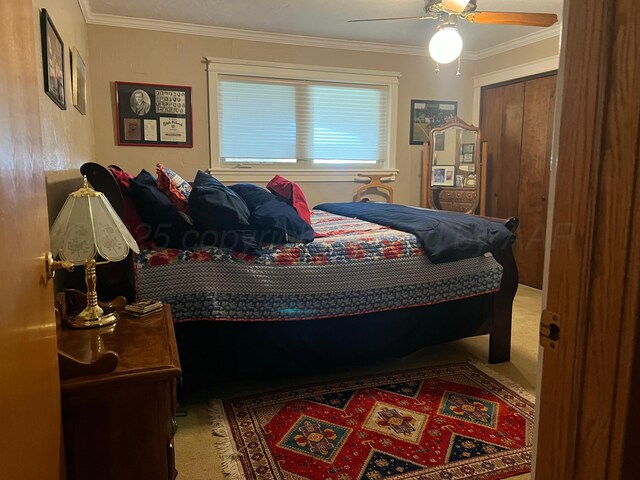 14680 County Road 6, Booker, TX 79005 - bedroom featuring carpet flooring, ornamental molding, and a ceiling fan