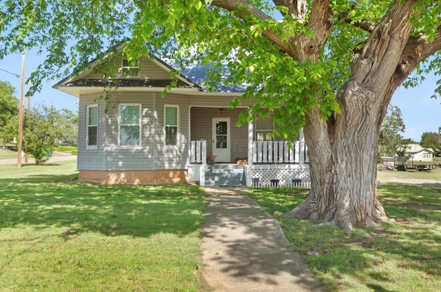 110 N Houston St, Shamrock, TX 79079 - view of front of home with covered porch and a front yard