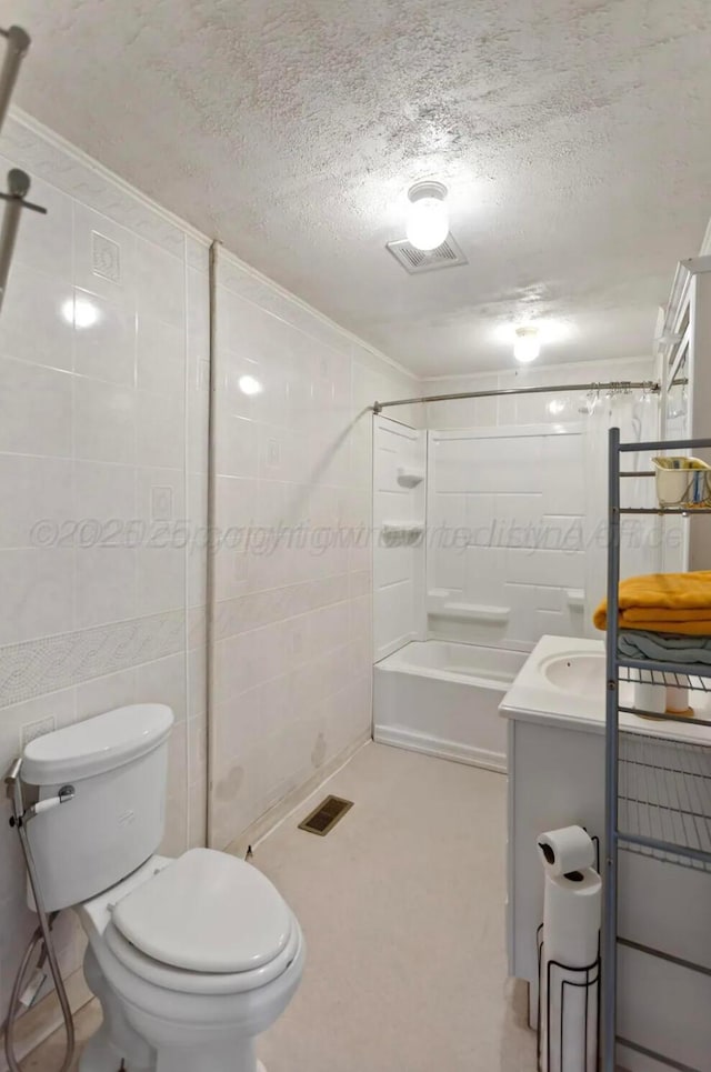 110 N Houston St, Shamrock, TX 79079 - full bath featuring vanity, a textured ceiling, and  shower combination