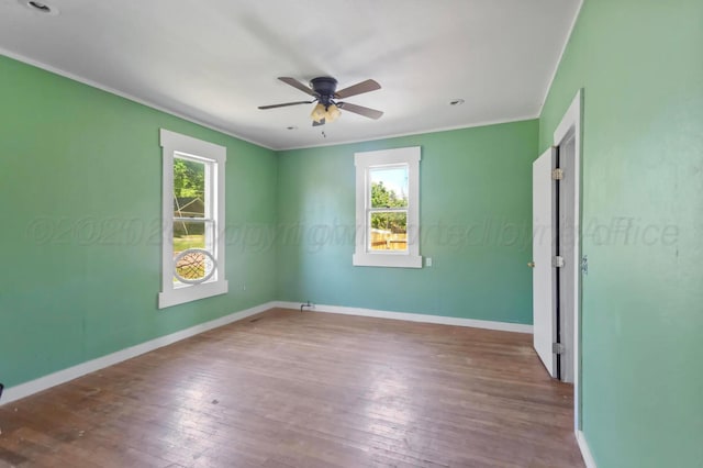 110 N Houston St, Shamrock, TX 79079 - spare room featuring hardwood / wood-style flooring, ornamental molding, and a ceiling fan