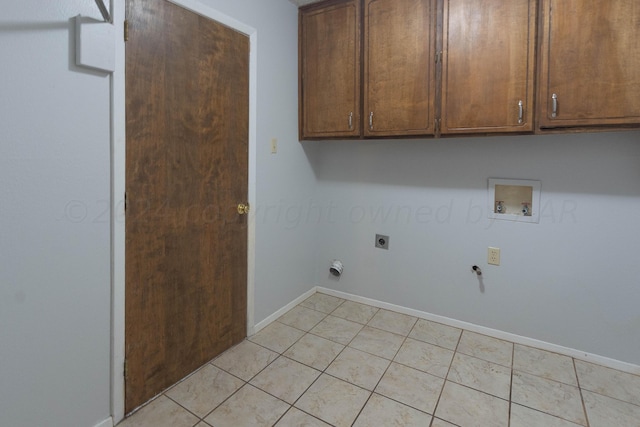 laundry room with gas dryer hookup, light tile patterned flooring, hookup for a washing machine, cabinets, and electric dryer hookup