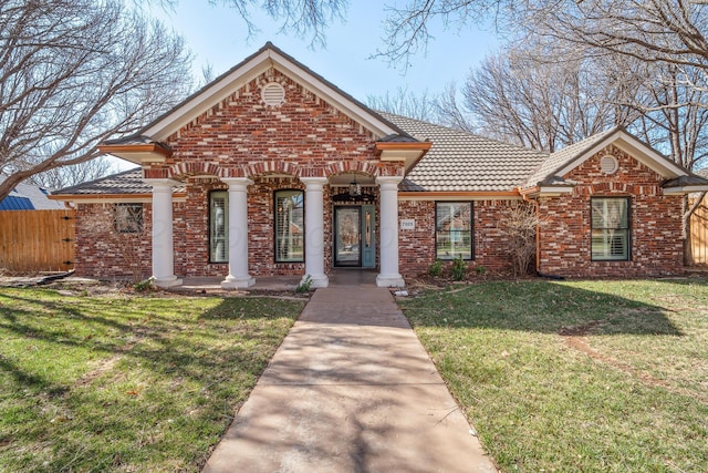 7809 Tarter Ave, Amarillo, TX 79121 - view of front of home with a tiled roof and brick siding
