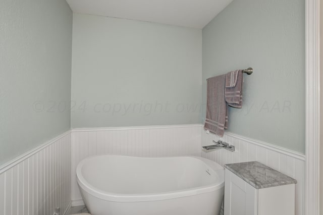 bathroom with a washtub