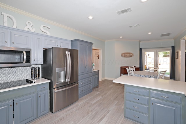 kitchen featuring french doors, ornamental molding, appliances with stainless steel finishes, tasteful backsplash, and light hardwood / wood-style floors