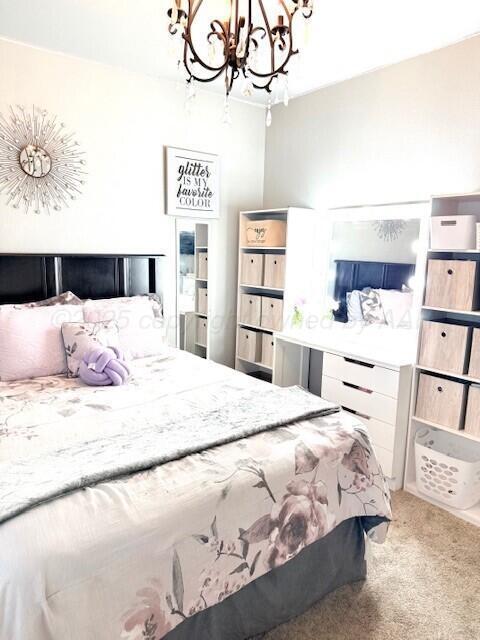 6508 Bayberry Ln, Amarillo, TX 79124 - carpeted bedroom featuring a chandelier