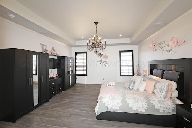 6508 Bayberry Ln, Amarillo, TX 79124 - bedroom featuring a chandelier, a raised ceiling, wood finished floors, and recessed lighting