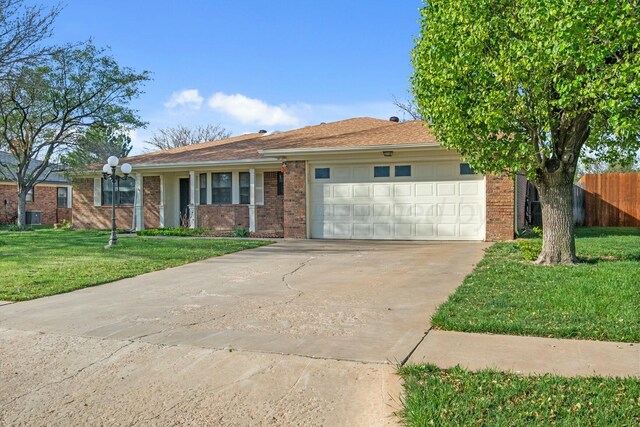 6206 Yale St, Amarillo, TX 79109 - ranch-style home featuring an attached garage, concrete driveway, and brick siding
