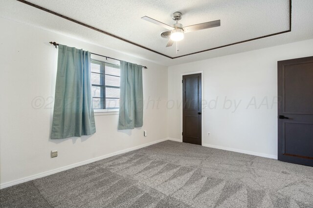 6206 Yale St, Amarillo, TX 79109 - spare room featuring carpet floors, ceiling fan, and a textured ceiling