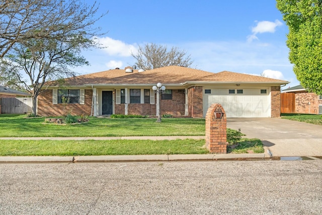 6206 Yale St, Amarillo, TX 79109 - ranch-style house featuring an attached garage, concrete driveway, and brick siding
