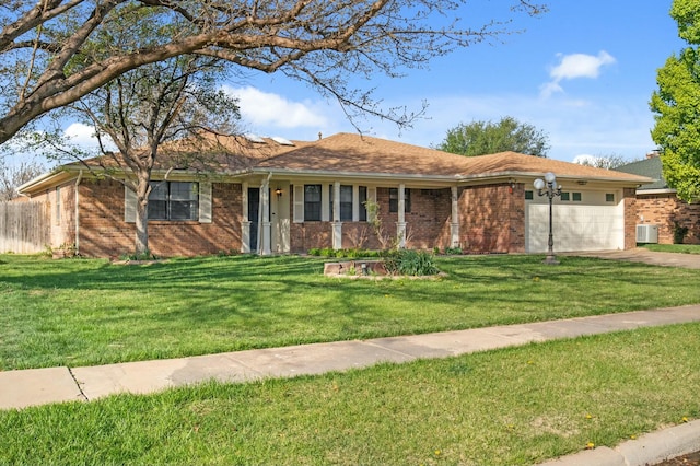 6206 Yale St, Amarillo, TX 79109 - ranch-style house with brick siding, an attached garage, concrete driveway, and a front lawn