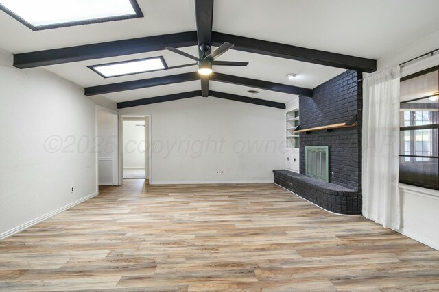6206 Yale St, Amarillo, TX 79109 - unfurnished living room featuring wood finished floors, a fireplace, and ceiling fan