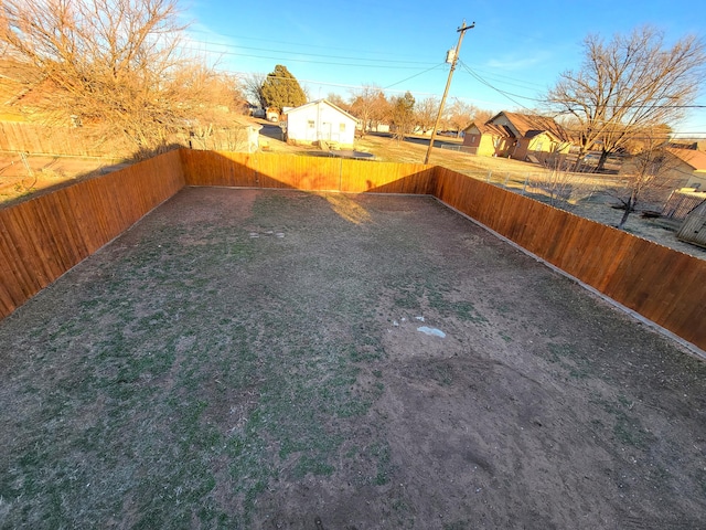 view of yard with a fenced backyard