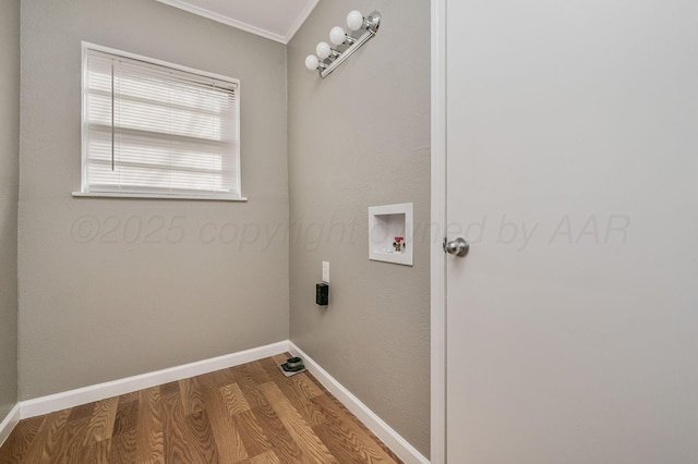 laundry area with hookup for a washing machine, laundry area, baseboards, and wood finished floors