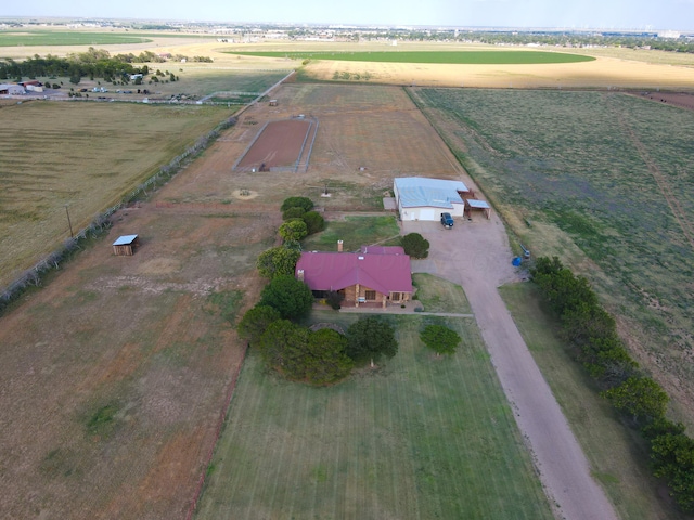 birds eye view of property with a rural view