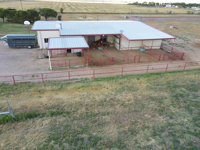 view of yard featuring a rural view and an outdoor structure