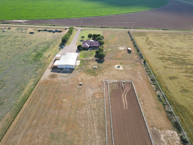 birds eye view of property with a rural view